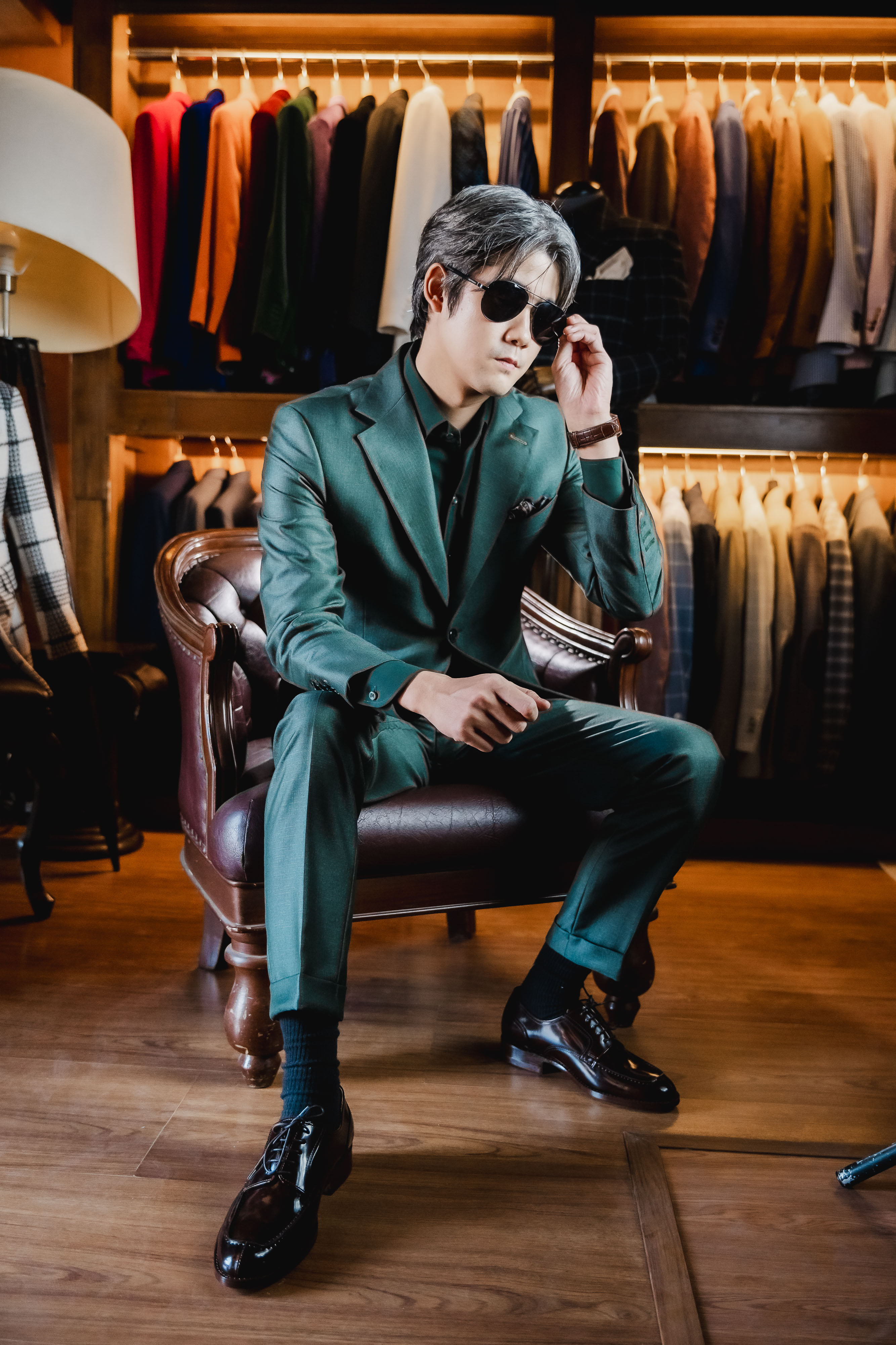 Green suit seated editorial