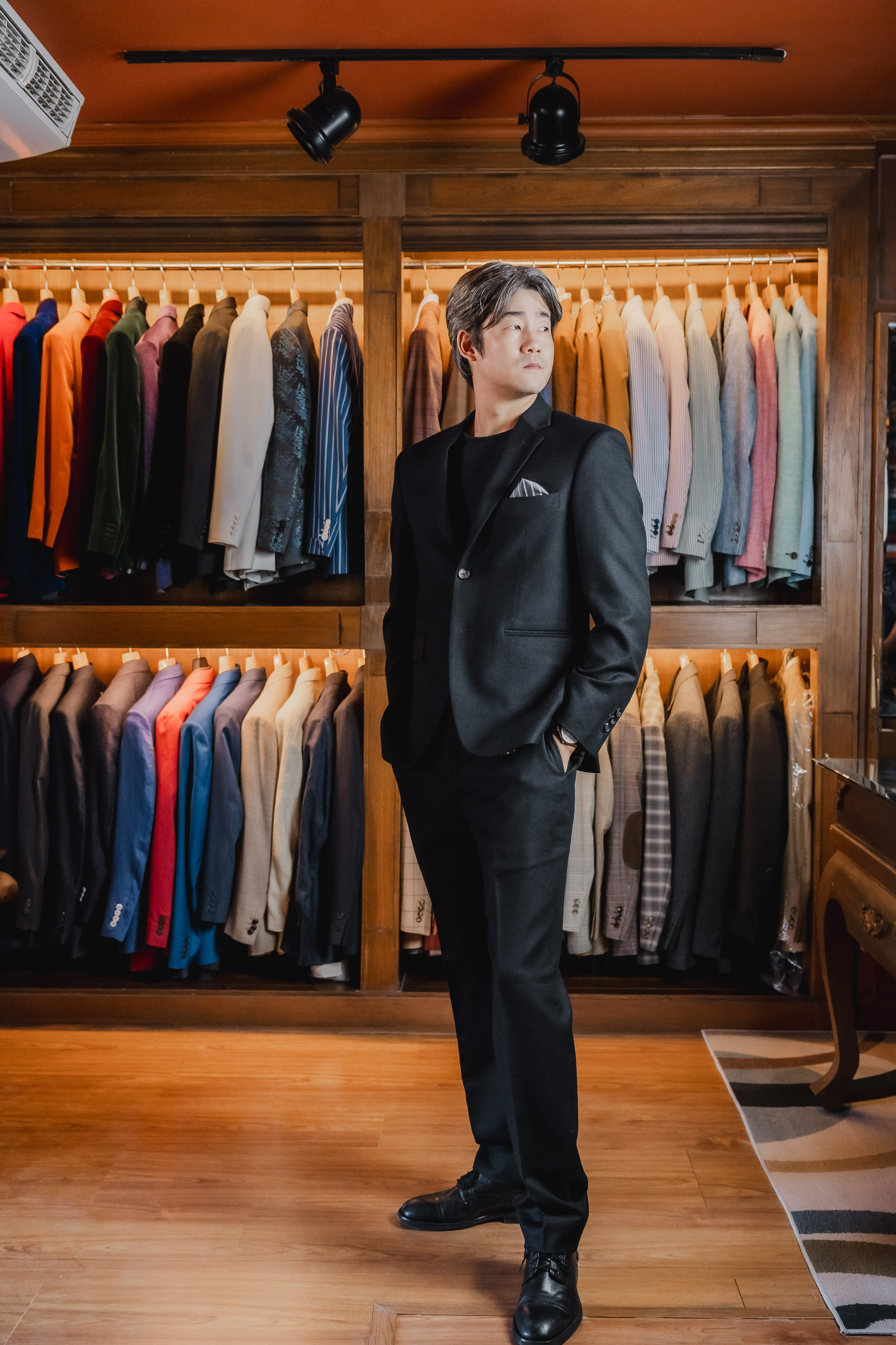 Black suit full-length in showroom