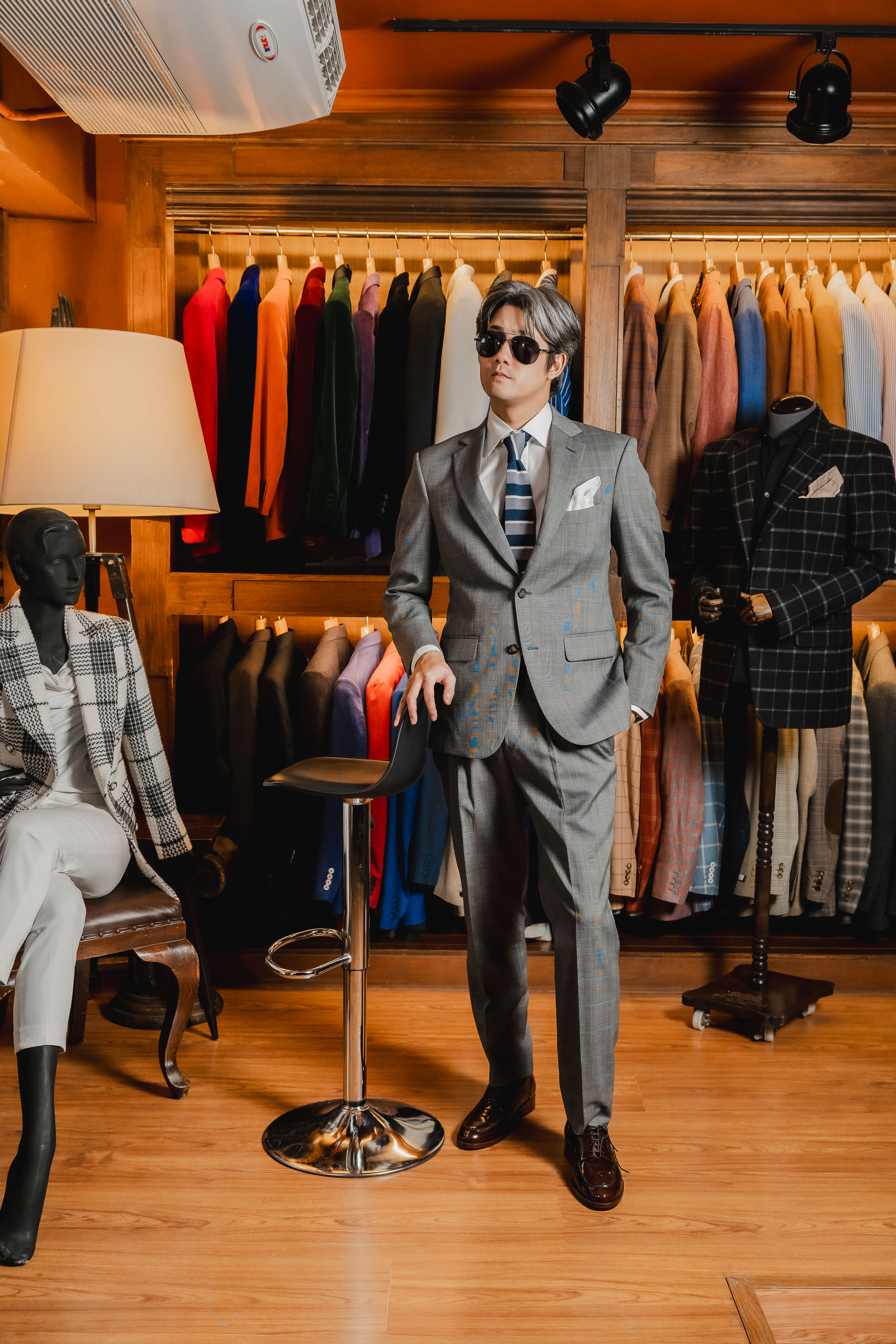 Grey suit full standing in showroom